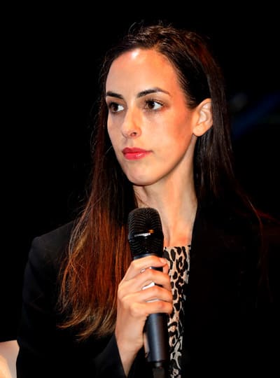 woman-in-dark-blazer-with-microphone woman